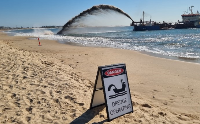 Ship performing sand dredging at Stockton Beach