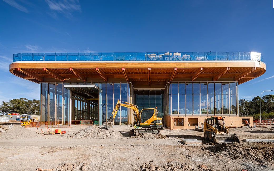 First Building exterior with digger
